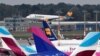 FILE - An Airbus A320 of Condor Airlines lands at the airport in Hamburg, Germany, Sept. 24, 2019. Air traffic resumed at the hub Monday after an emailed threat against an Iranian plane that had landed there shortly after noon.