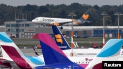 FILE - An Airbus A320 of Condor Airlines lands at the airport in Hamburg, Germany, Sept. 24, 2019. Air traffic resumed at the hub Monday after an emailed threat against an Iranian plane that had landed there shortly after noon.