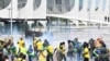 FILE - Supporters of former Brazilian President Jair Bolsonaro clash with police during a demonstration outside the Planalto Palace in Brasilia, Jan. 8, 2023.
