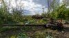 FILE - A destroyed tank near the village of Malaya Rohan, Kharkiv region, Ukraine, May 16, 2022. Twitter is stepping up its fight against misinformation with a new policy cracking down on posts that spread potentially dangerous false stories. 