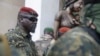 FILE - Guinea junta leader Col. Mamady Doumbouya, leaves a meeting with an ECOWAS delegation in Conakry, Guinea, Sept. 10, 2021. Authorities recently dissolved dozens of political parties.