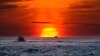 FILE - Lobster fishermen work at sunrise in the Atlantic Ocean, Sept. 8, 2022, off of Kennebunkport, Maine. Scientists, lawyers and government officials are gathered in Jamaica the week of Nov. 1, 2022 to debate deep sea mining