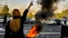 FILE - In this photo taken by an individual not employed by the Associated Press and obtained by the AP outside Iran, Iranians protest the death of Mahsa Amini, 22, after she was detained by the morality police, in Tehran, Oct. 1, 2022.