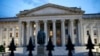 FILE - The U.S. Treasury Department building at dusk in Washington. 