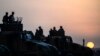 FILE - Turkish troops take position in the southeastern town of Suruc, Sanliurfa province, near the Mursitpinar border crossing with Syria, Oct. 3, 2014. 