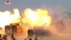FILE - This image broadcast by North Korea's KRT on April 26, 2017, shows a "combined fire demonstration" in Wonsan, North Korea. North Korea is apparently moving to sell millions of rockets and artillery shells – many of them likely from old stock – to R