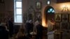 Ukrainians attend a Christmas mass at an Orthodox Church in Bobrytsia outskirts of Kyiv, Dec. 25, 2022. 