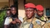 FILE - Burkina Faso's military leader Ibrahim Traore is escorted by soldiers in Ouagadougou, Oct. 2, 2022.