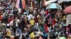 FILE - Shoppers crowd a market in Nigeria's commercial capital of Lagos, Aug. 15, 2019. Eight countries worldwide, including Nigeria, are expected to account for more than half of the global population growth over the next three decades. 
