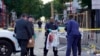 Philadelphia Police investigators work the scene of a fatal overnight shooting on South Street in Philadelphia, Pennsylvania, June 5, 2022.