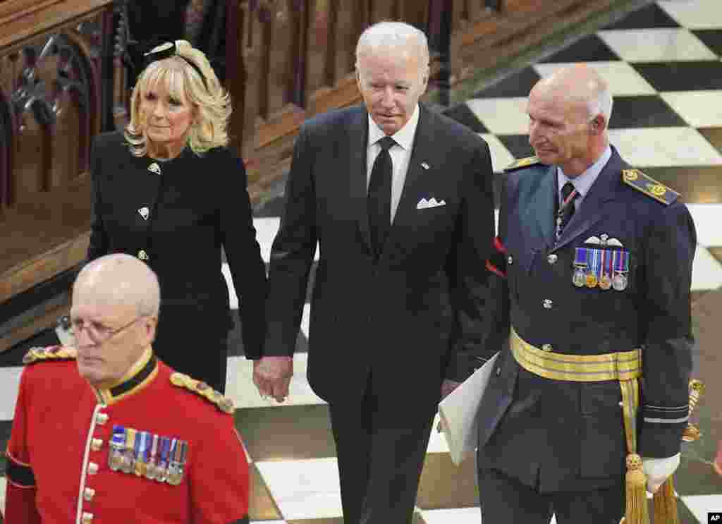 U.S. President Joe Biden, center, and First Lady Jill Biden arrive for the funeral service of Queen Elizabeth II at Westminster Abbey in central London, Sept. 19, 2022.