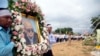 Relatives carry a portrait of former Khmer Rouge's chief ideologist and No. 2 leader, Nuon Chea, during his funeral procession in Pailin in northwestern Phnom Penh, Cambodia, Aug. 9, 2019.