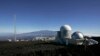 FILE - This Oct. 25, 2009, photo shows the Mauna Loa Observatory atmospheric research facility on the island of Hawaii. The volcano of Mauna Kea is seen in the background.