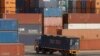 A truck ferries a shipping container at a port in the southern Indian city of Chennai, February 13, 2013.