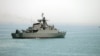 FILE - In this picture taken April 7, 2015, and released by the semiofficial Fars News Agency, the Iranian warship Alborz, foreground, prepares before leaving Iran's waters, at the Strait of Hormuz. Located on the eastern edge of the Persian Gulf, the Strait of Hormuz is one of the world's most important export routes.