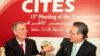 FILE - Masanori Miyahara, head of Japan's delegation and the country's top fisheries official, right, shakes hands with Patrick van Klaveren, head of the Monaco delegation, during a meeting of the Convention on International Trade in Endangered Species (
