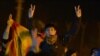 Kurds shout slogans to praise three women activists who were found shot dead in Paris, as ambulances, unseen, carry their coffins at an airport in Diyarbakir, Turkey, January 16, 2013.