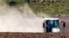 The hot air shimmers in front of a tractor during a long time of drought near Bad Lauchstaedt, Germany, April 27, 2020. 