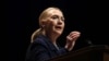 Secretary of State Hillary Rodham Clinton gestures as she gives a speech at Dublin City University in Dublin, Ireland, December 6, 2012.