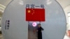 Liu Hong, chief designer of the Lunar Palace 365 Project stands outside a simulated space cabin in which volunteers temporarily live as a part of the project at Beihang University in Beijing, China, July 9, 2017.