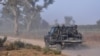 FILE - Members of the Cameroonian Rapid Intervention Force patrol, March 21, 2019, on the outskirt of Mosogo in the far north region of the country where Boko Haram jihadist have been active since 2013.