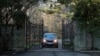 FILE - A car with diplomatic license plates drives out of a compound near Glen Cove, N.Y., on Long Island, Dec. 30, 2016. 