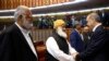 Pakistani legislators greet Turkey's President Recep Tayyip Erdogan, right, after his address at the parliament in Islamabad, Pakistan, Thursday, Nov. 17, 2016. 