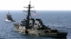 FILE - The U.S. Navy destroyer USS Cole is towed away from the port city of Aden, Yemen, into open sea, Oct. 29, 2000. 
