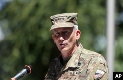 FILE - Commander of the Resolute Support mission and U.S. Forces in Afghanistan Army Gen. John W. Nicholson speaks during an opening ceremony of "Invictus Games" at the Resolute Support Headquarters, in Kabul, Afghanistan, May 13 , 2017.