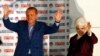 Turkey's Prime Minister Recep Tayyip Erdogan celebrates his election victory flanked by his wife Ermine in front of his party's headquarters in Ankara, August 10, 2014.