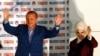 Turkey's Prime Minister Recep Tayyip Erdogan celebrates his election victory flanked by his wife Ermine in front of his party's headquarters in Ankara August 10, 2014.
