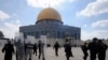 FILE - Israeli forces take position during clashes with Palestinian worshippers at the Al-Aqsa Mosque compound in Jerusalem's Old City.