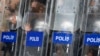 Turkish riot police use their shields to protect themselves as they clash with protesters in central Istanbul, July 8, 2013. 