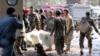 Afghan National Army (ANA) soldiers transport a victim to an ambulance after a suicide attack in Lashkar Gah, Helmand province, Afghanistan, Feb. 11, 2017.