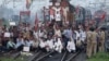 Demonstrators from the Samajwadi Party, a regional political party, shout slogans after they stopped a passenger train during a protest near Allahabad railway station, September 20, 2012. 