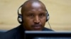 Congolese warlord Bosco Ntaganda looks on during his first appearance before judges at the International Criminal Court in the Hague, March 26, 2013. 