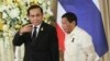 Philippine President Rodrigo Duterte, right, and Thailand's Prime Minister Prayuth Chan-ocha walk together as they leave a joint news conference at the government house in Bangkok, Thailand, March 21, 2017. Duterte is in Thailand for a two-day visit, rounding out his southeast Asia tour.