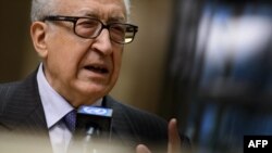 UN-Arab League peace envoy Lakhdar Brahimi gestures during a stakeout following a meeting with top US and Russian officials on the Syrian conflict at the United Nations office in Geneva, January 11, 2013.