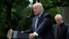 President Donald Trump, accompanied by Washington Cardinal Donald Wuerl, speaks in the Rose Garden of the White House in Washington, May 4, 2017, before signing an executive order aimed at easing an IRS rule limiting political activity for churches. 