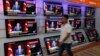 A televised news conference of Turkish Prime Minister Tayyip Erdogan is shown on televisions at an electronics shop in Istanbul, Sep. 30, 2013. 