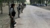 Kurdish Democratic Union Party (PYD) members stand guard during a Labour Day celebration in Efrin May 1, 2014.