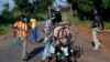 FILE - Armed anti-balaka militiamen man a checkpoint some 60 kms north of Bangui, Central African Republic, Sunday June 1, 2014. 