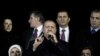 Turkey's Prime Minister Tayyip Erdogan (C) addresses his supporters upon his arrival to Ataturk Airport in Istanbul, Dec. 27, 2013.