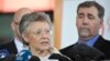 International AIDS Society president Françoise Barre-Sinoussi of France addresses the media in Melbourne on July 19, 2014 while executive director Owen Ryan of Switzerland (L) and president-elect Chris Beyrer (R) (R) of the US look on. 