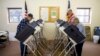 FILE - Voters cast ballots in the primary election in Chesterville, Ohio, March 15, 2016. President Donald Trump made unsubstantiated claims that millions of people voted illegally in the 2016 election.