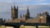 FILE - The British union flag flutters on the Victoria Tower at the Houses of Parliament in London, Dec. 30, 2020. 