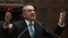 Turkey's Prime Minister Recep Tayyip Erdogan addresses his supporters at the parliament in Ankara, Jan. 14, 2014.