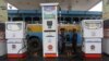 An employee fills diesel in a public bus at a fuel station in Kolkata, August 13, 2012. 