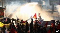 Turkish police deploy water cannons, fire teargas to disperse protesters on first anniversary of anti-government protests, Ankara, May 31, 2014.