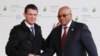 South Africa's President Jacob Zuma (R) is greeted by France's Prime Minister Manuel Valls as he arrives for the COP21 United Nations Climate Change Conference on Nov. 30, 2015 in Le Bourget, outside Paris.